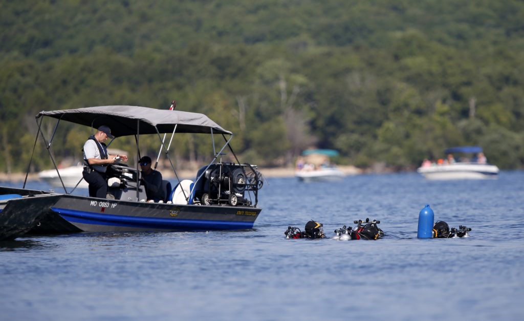 Photo of divers going to retrieve the duck boat that sank in Branson, Mo.