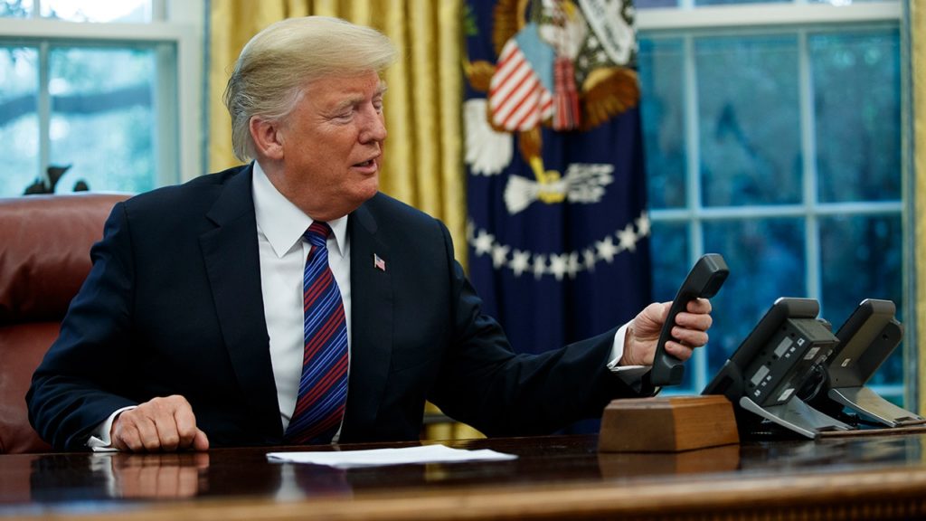 Photo of Donald Trump holding a phone
