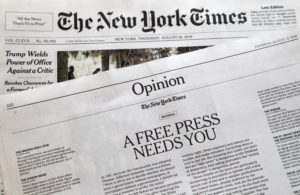 Photo of editorials from New York Times and Boston Glove