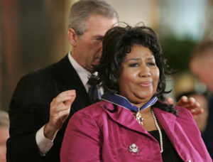 Photo of President George W. Bush giving Aretha Franklin the presidential medal