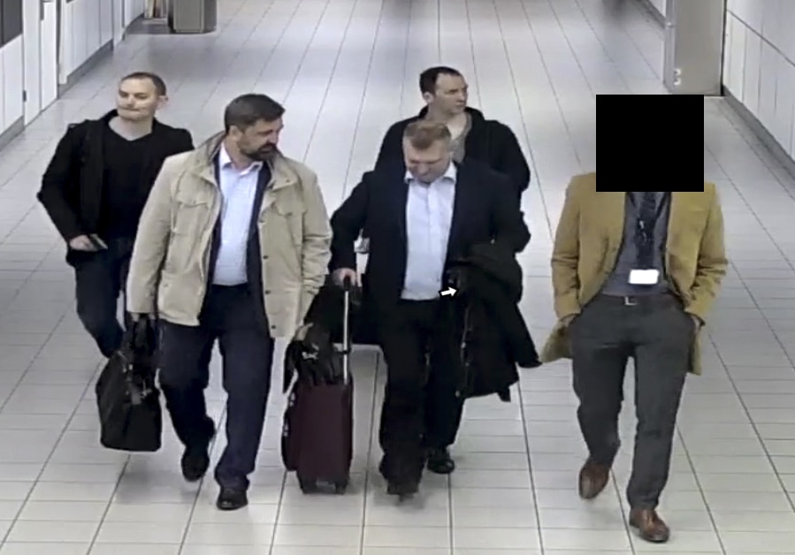 Photo of Russian officers of the Main Directorate of the General Staff of the Armed Forces of the Russian Federation, GRU, being escorted to their flight