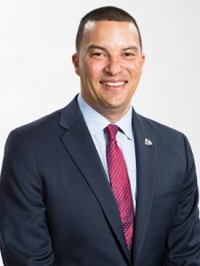 Portrait of Fresno State men's basketball coach Justin Hutson