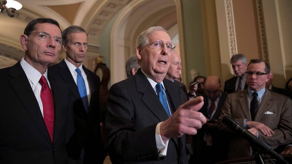 Photo of Senate Majority Leader Mitch McConnell, R-Ky., joined from left by Sen. John Barrasso, R-Wyo., and Sen. John Thune, R-S.D.