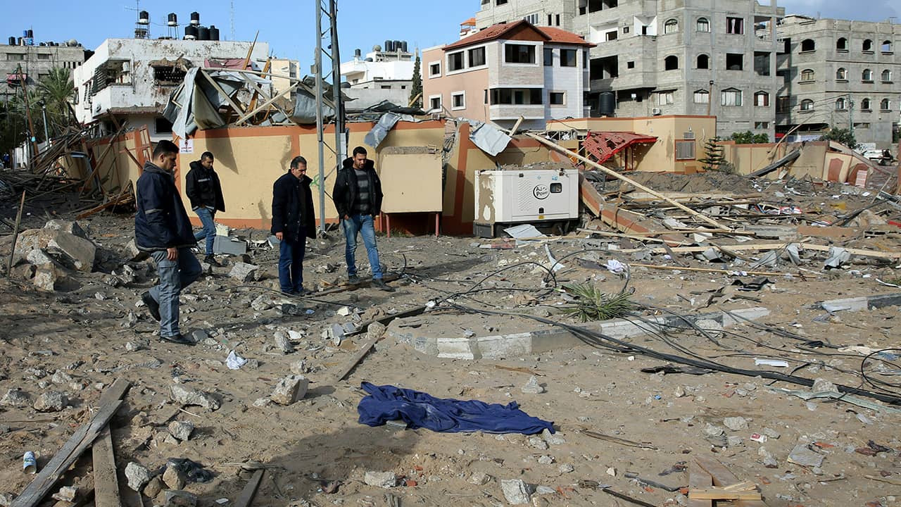 Photos of Palestinians inspecting the damage in Gaza City