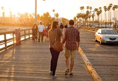 Photo of a couple walking on Santa Barbara pier.