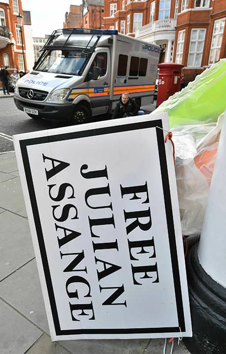 Photo of a police car parked outside after the arrest of Julian Assange