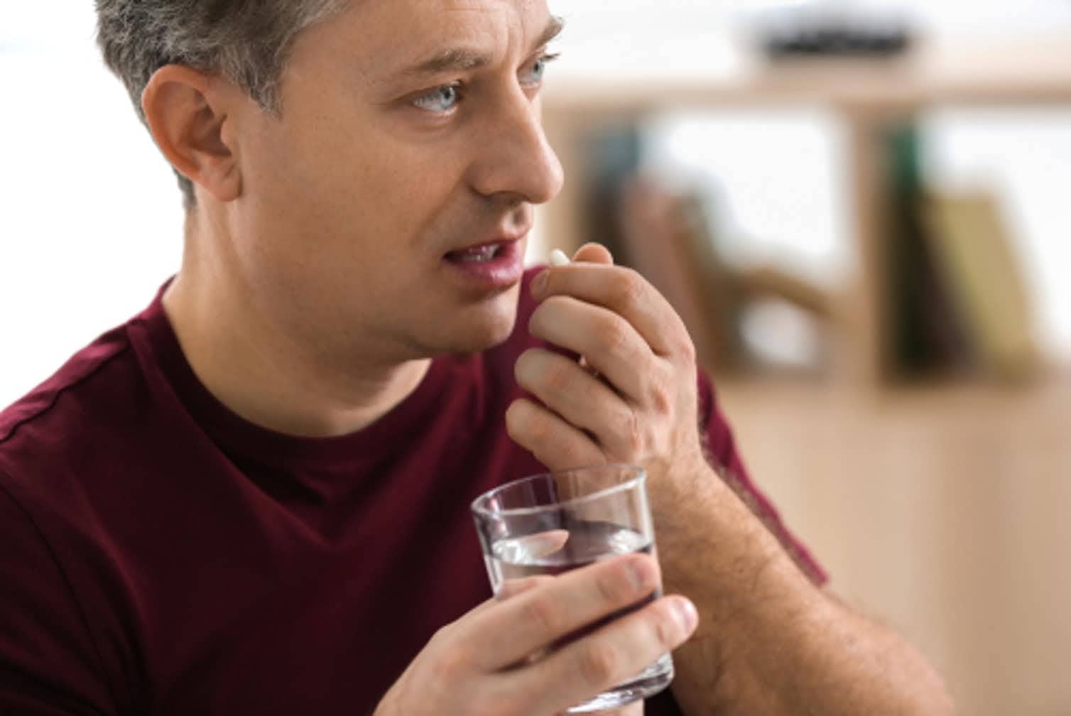 Photo of person taking antibiotics