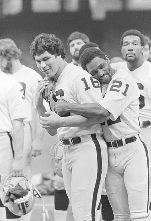 Photo of Cliff Branch hugging Jim Plunkett
