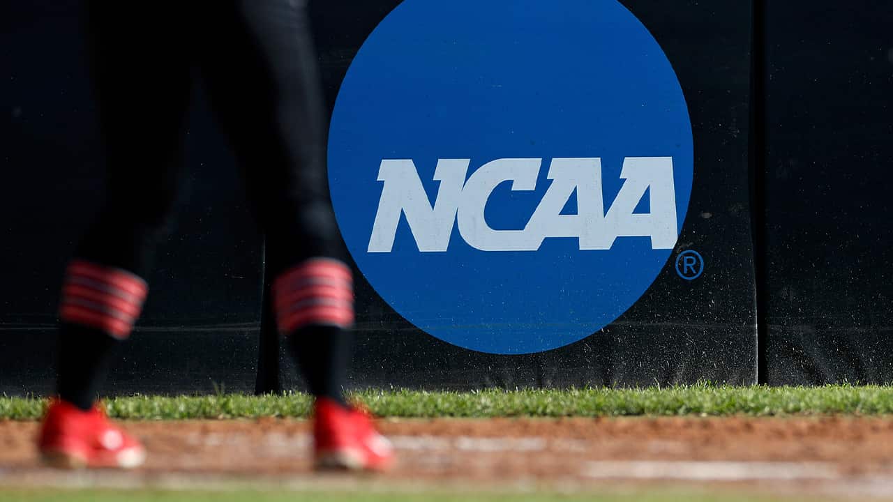 Photo of an athlete near the NCAA logo