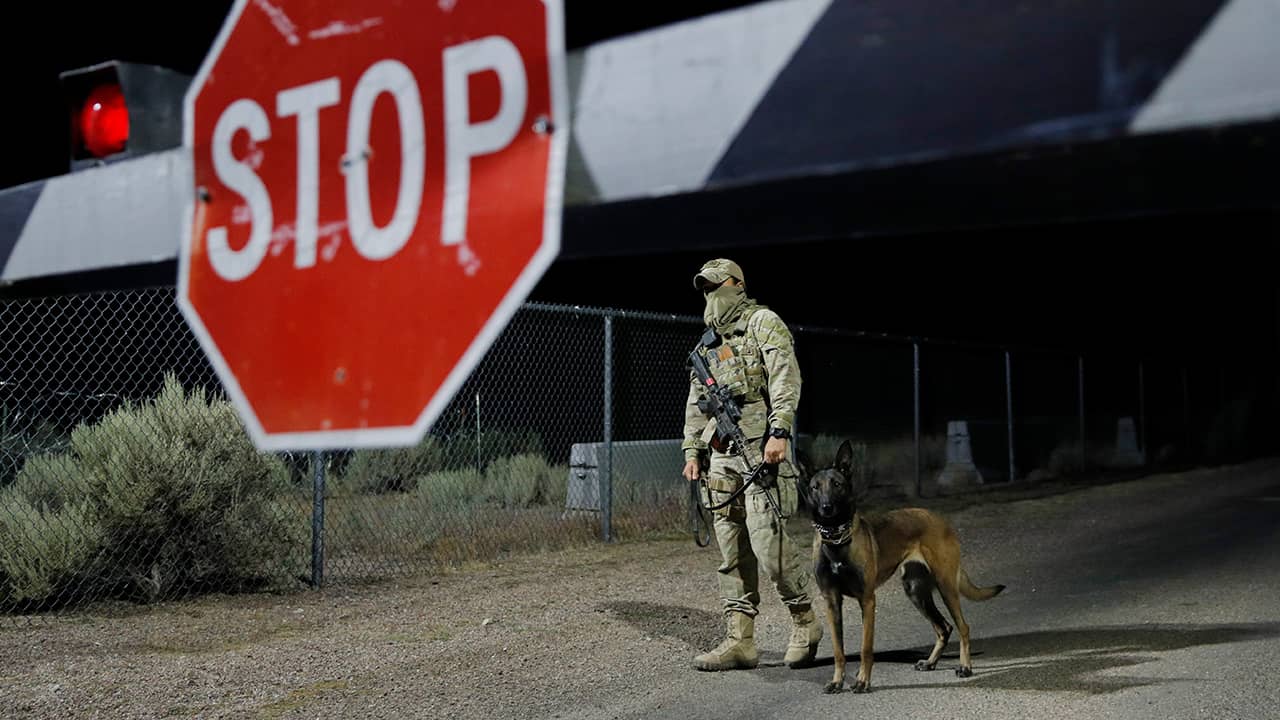 Photo of a security guard and his dog near Area 51