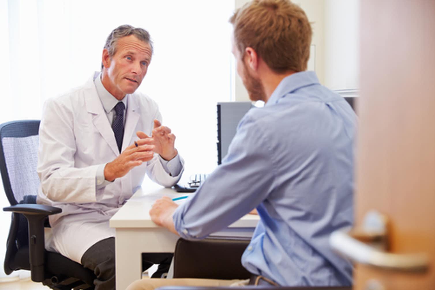 Photo of a doctor talking with a patient
