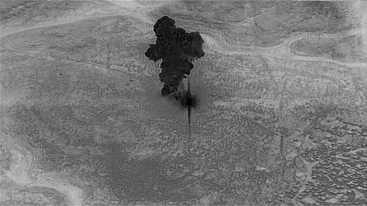 Photo of a remotely piloted aircraft focused on the compound of Islamic State leader Abu Bakr al-Baghdadi