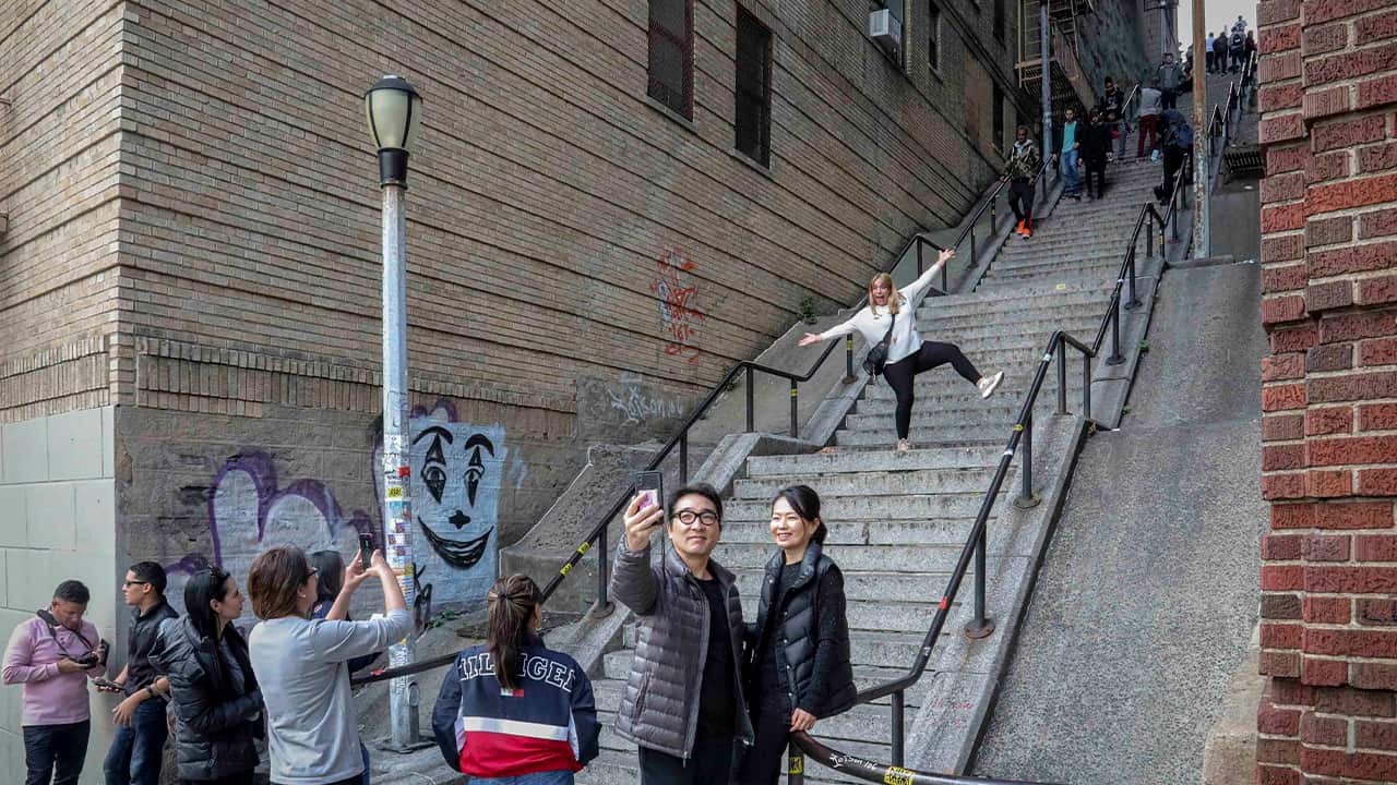 Photo of people posing on the Joker stairs