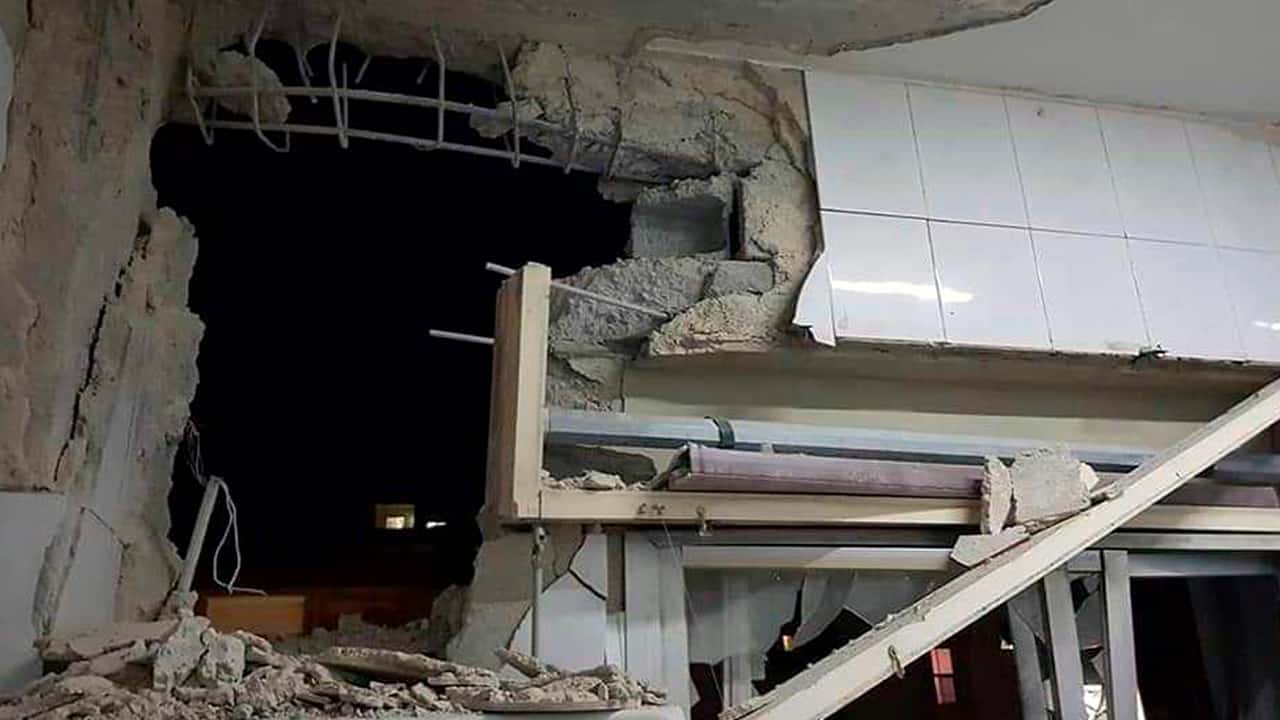 Photo of a damaged building targeted by Israeli missile strikes