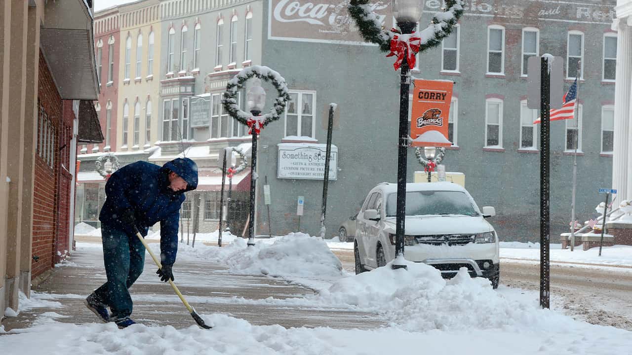 Photo of a man shoveling snow