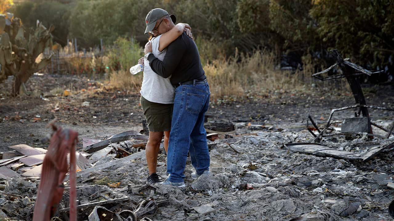 Photo of Justo and Bernadette Laos hugging