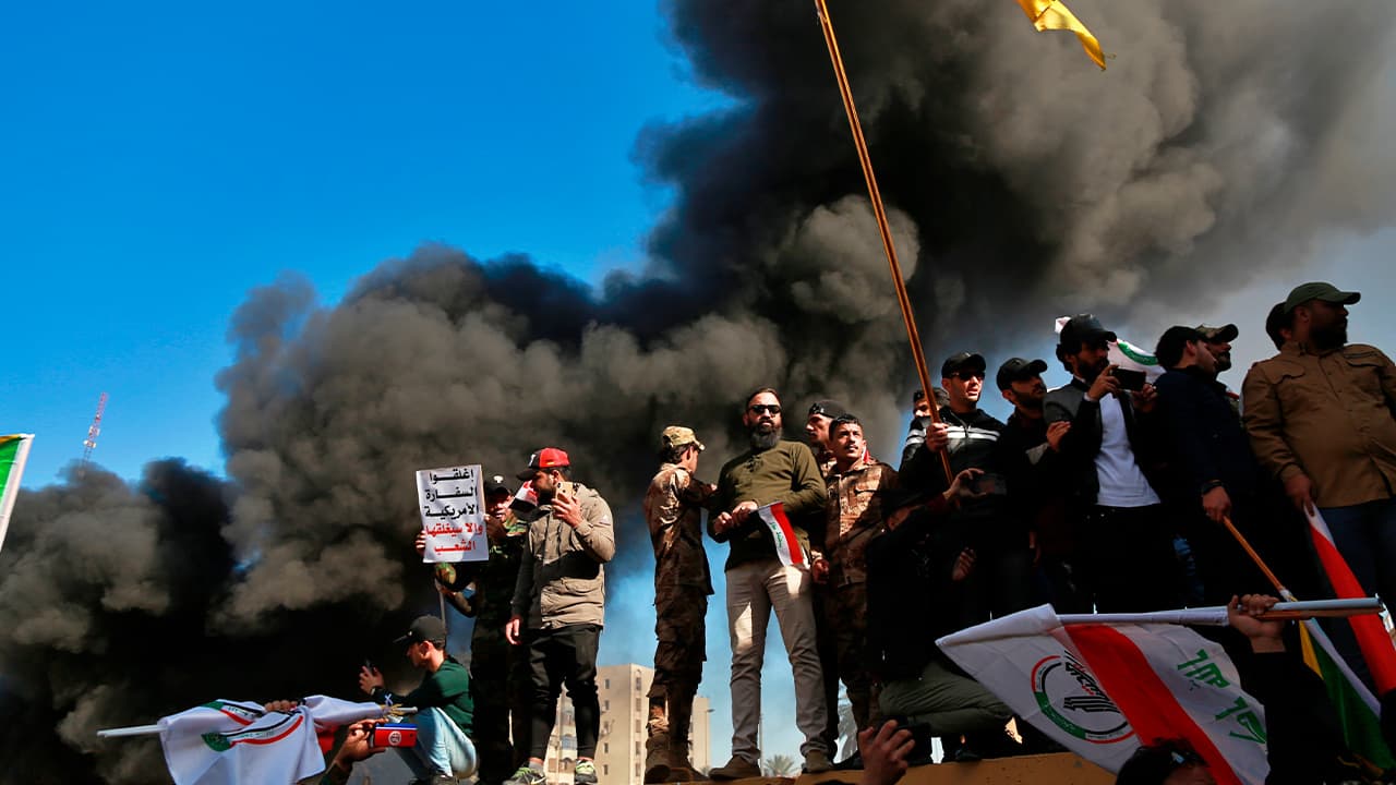 Photo of protesters burning property in front of the U.S. Embassy in Iraq