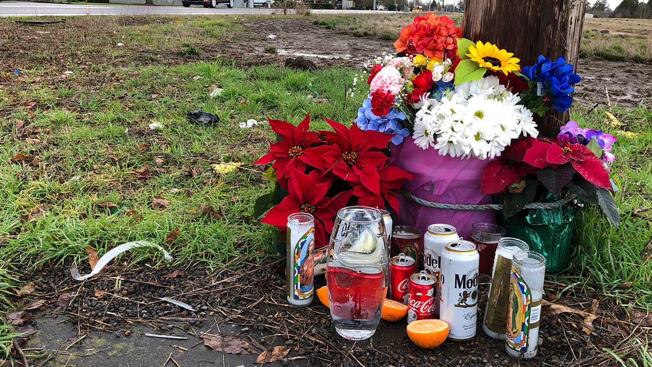 Photo of a memorial at the scene where three Christmas tree farm workers were killed