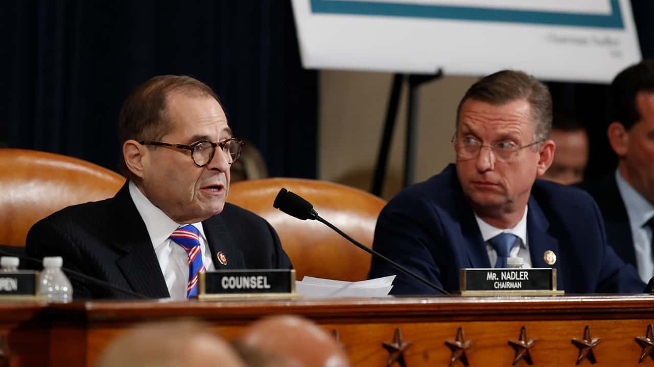 Photo of House Judiciary Committee ranking member Rep. Doug Collins, R-Ga., looking over to Chairman Rep. Jerrold Nadler