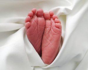 Photo of baby's feet sticking out of a blanket