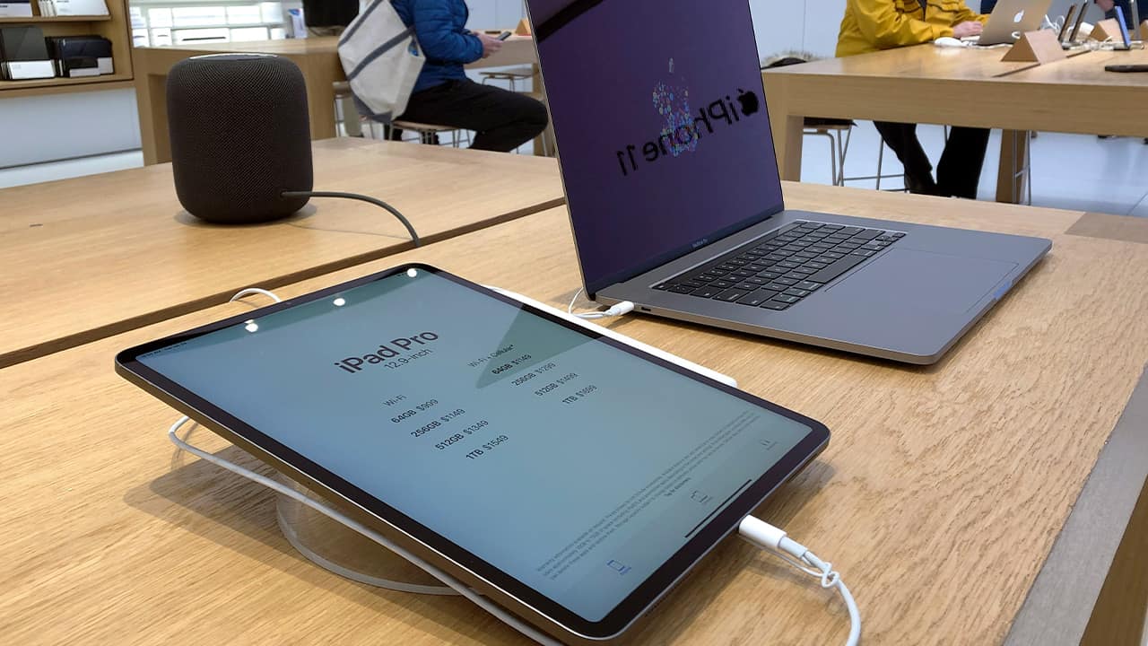 Photo of an iPad and an iMac