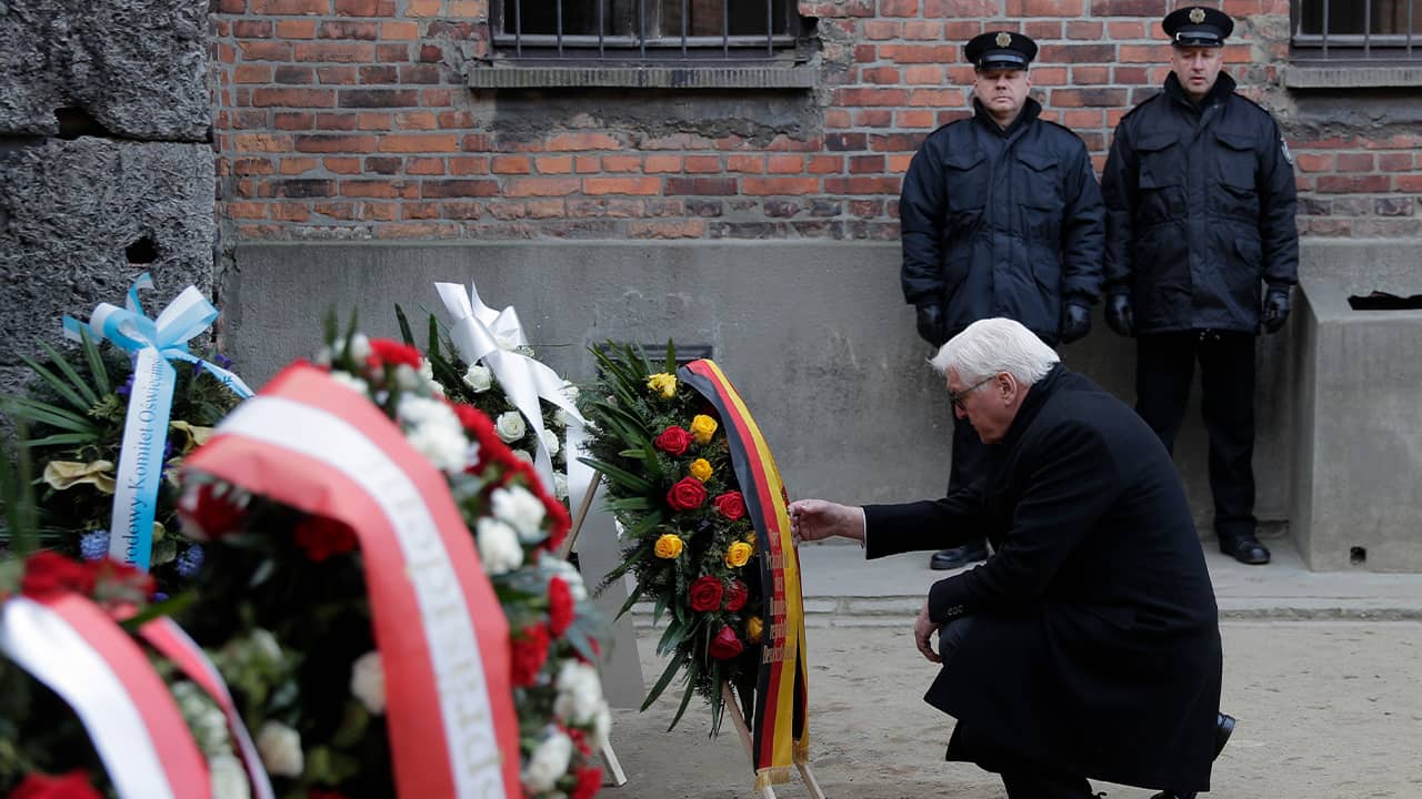 Photo of Germany's President Frank-Walter Steinmeier laying a wreath at the Death Wall at the Auschwitz I Nazi death camp in Oswiecim, Poland