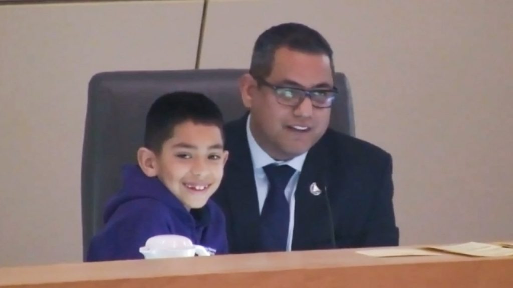 Photo of Councilman Miguel Arias and his son