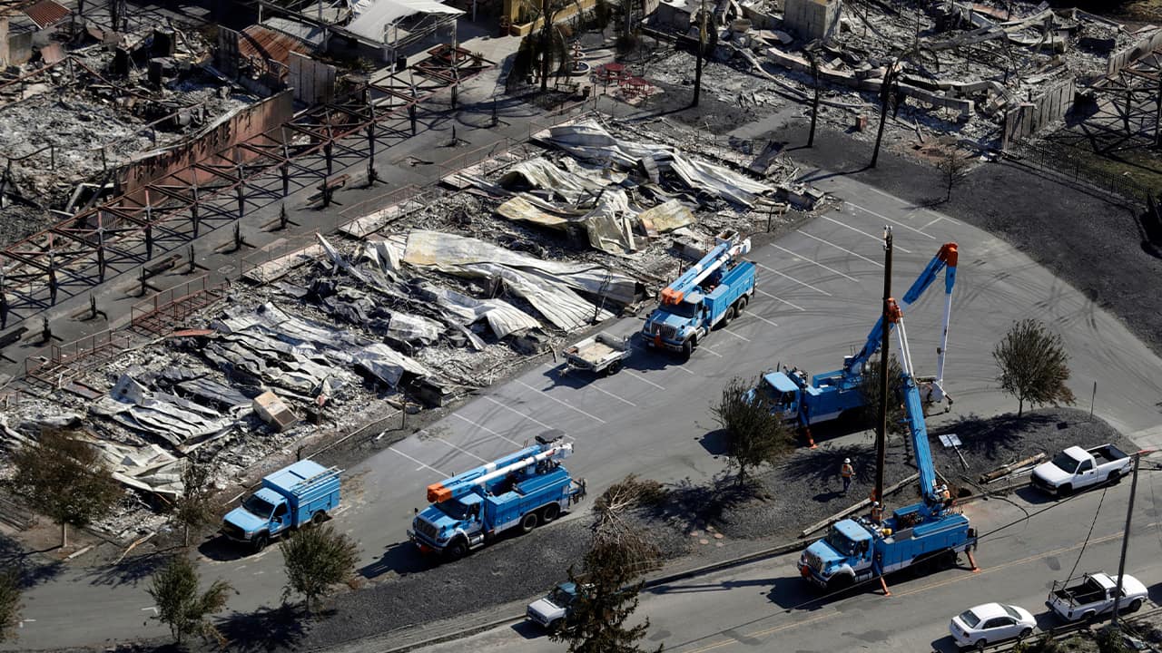 Photo of PG&E crew work on restoring power lines in Santa Rosa, Calif.