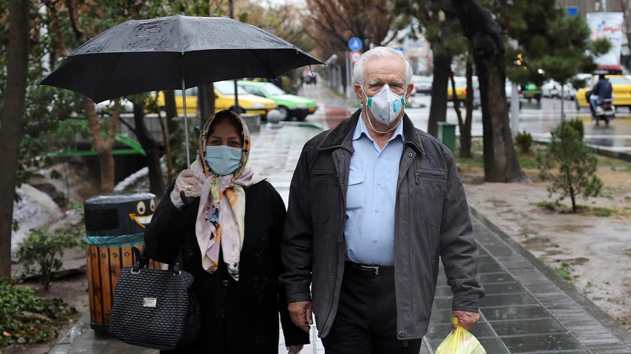 Photo of pedestrians wearing masks in Tehran, Iran