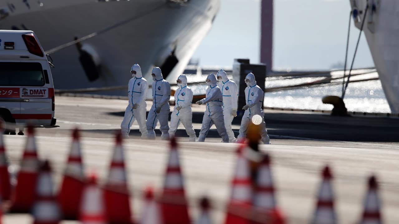 Photo of medical workers with protective suits