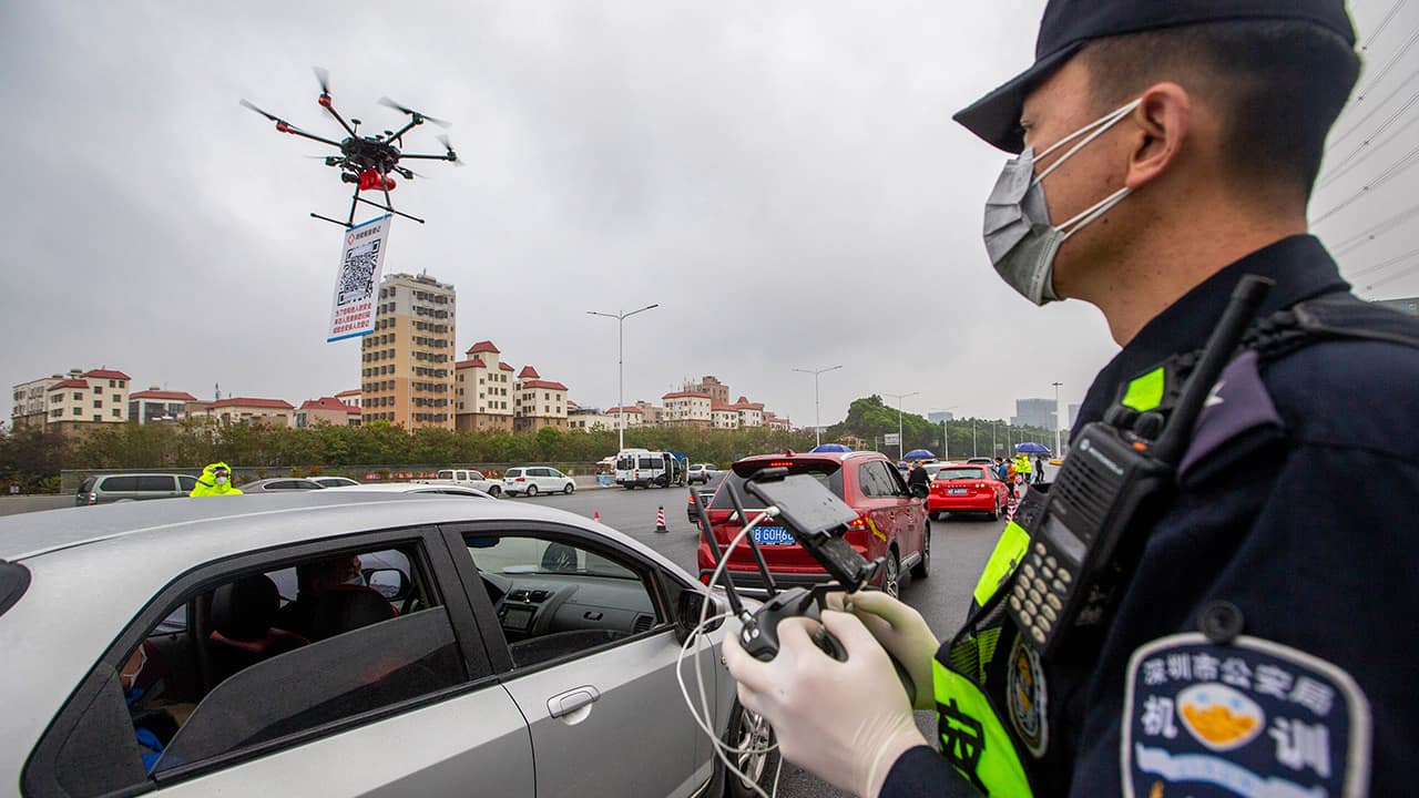 Photo of a police officer operating a drone in China's Guangdong Providence