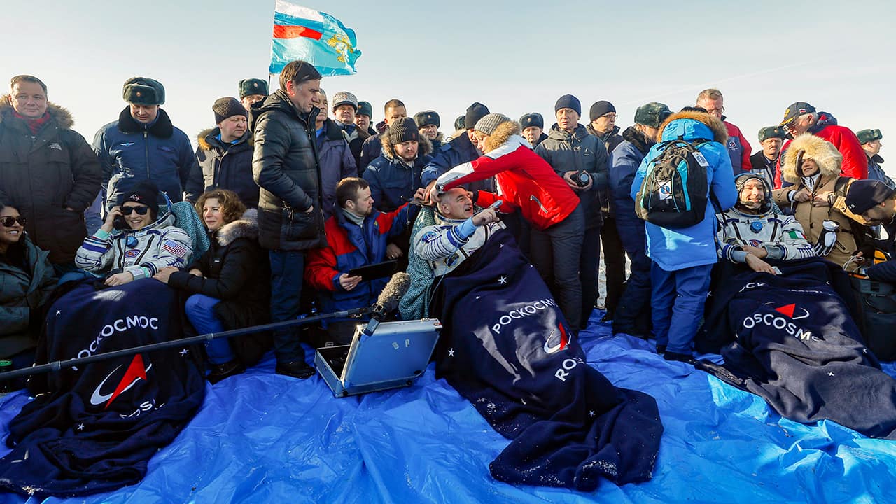 Photo of U.S. astronaut Christina Koch, left, Italian astronaut Luca Parmitano, right, and Russian cosmonaut Alexander Skvortsov
