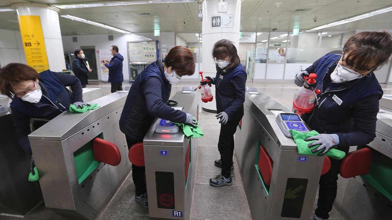 Photo of employees disinfecting ticket gates in South Korea