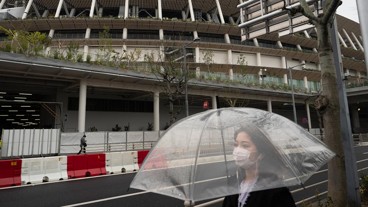 Photo of a woman walking in Tokyo