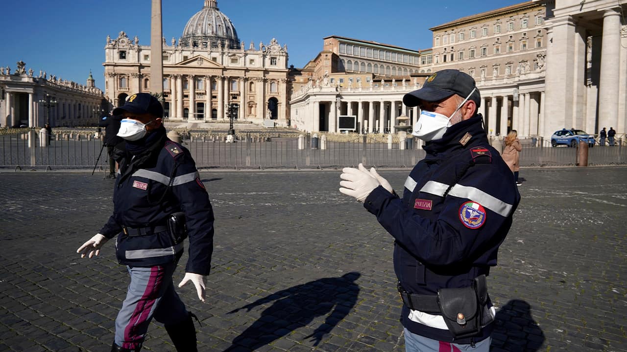 Photo of police officers wearing masks at the Vatican