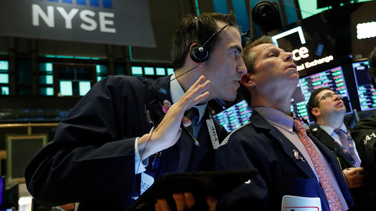 Photo of traders on the floor of the New York Stock Exchange