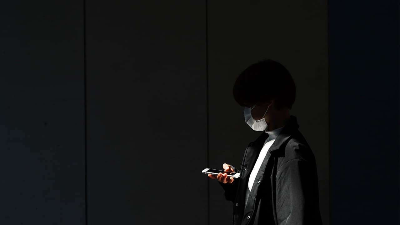 Photo of a woman looking at her phone