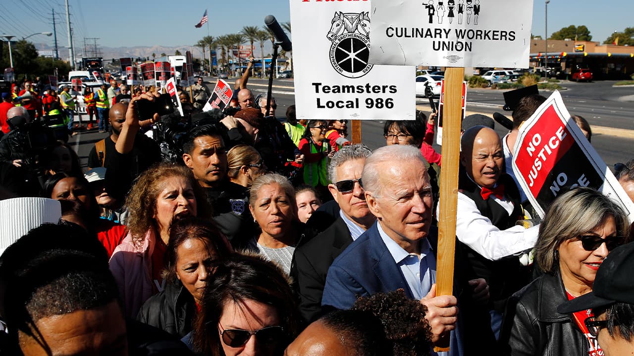 Photo of Joe Biden walking on a picket line