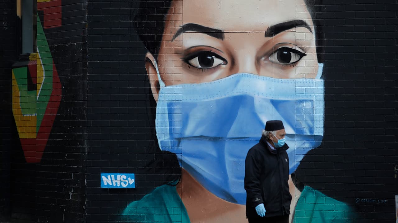 Photo of a man wearing a mask in London
