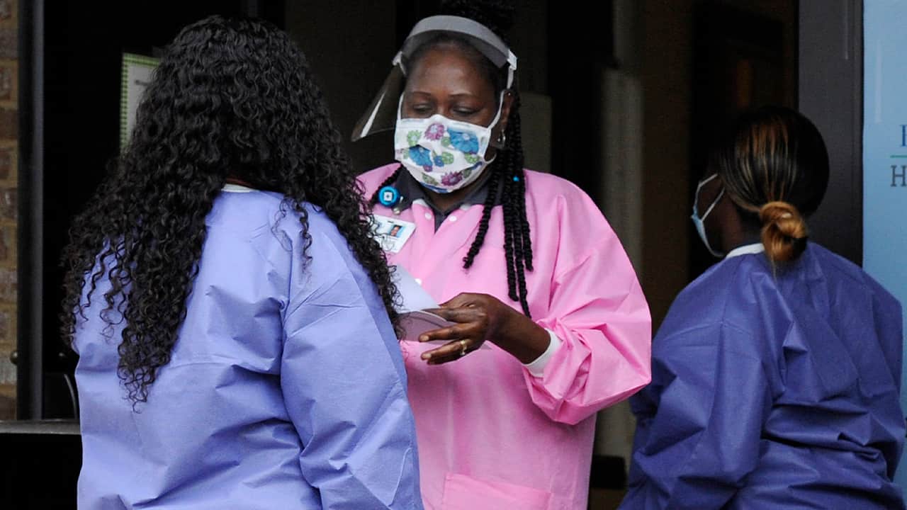 Photo of health care workers outside a Lowndes County coronavirus testing site