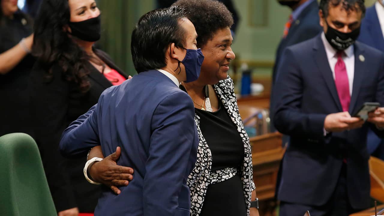 Assemblywoman Shirley Weber, D-San Diego, right, receives congratulations from Assemblyman David Chiu, D-San Francisco