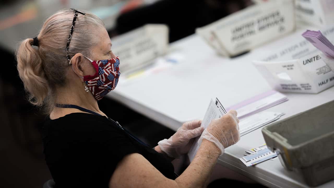 Photo of a woman working in an elections headquarters